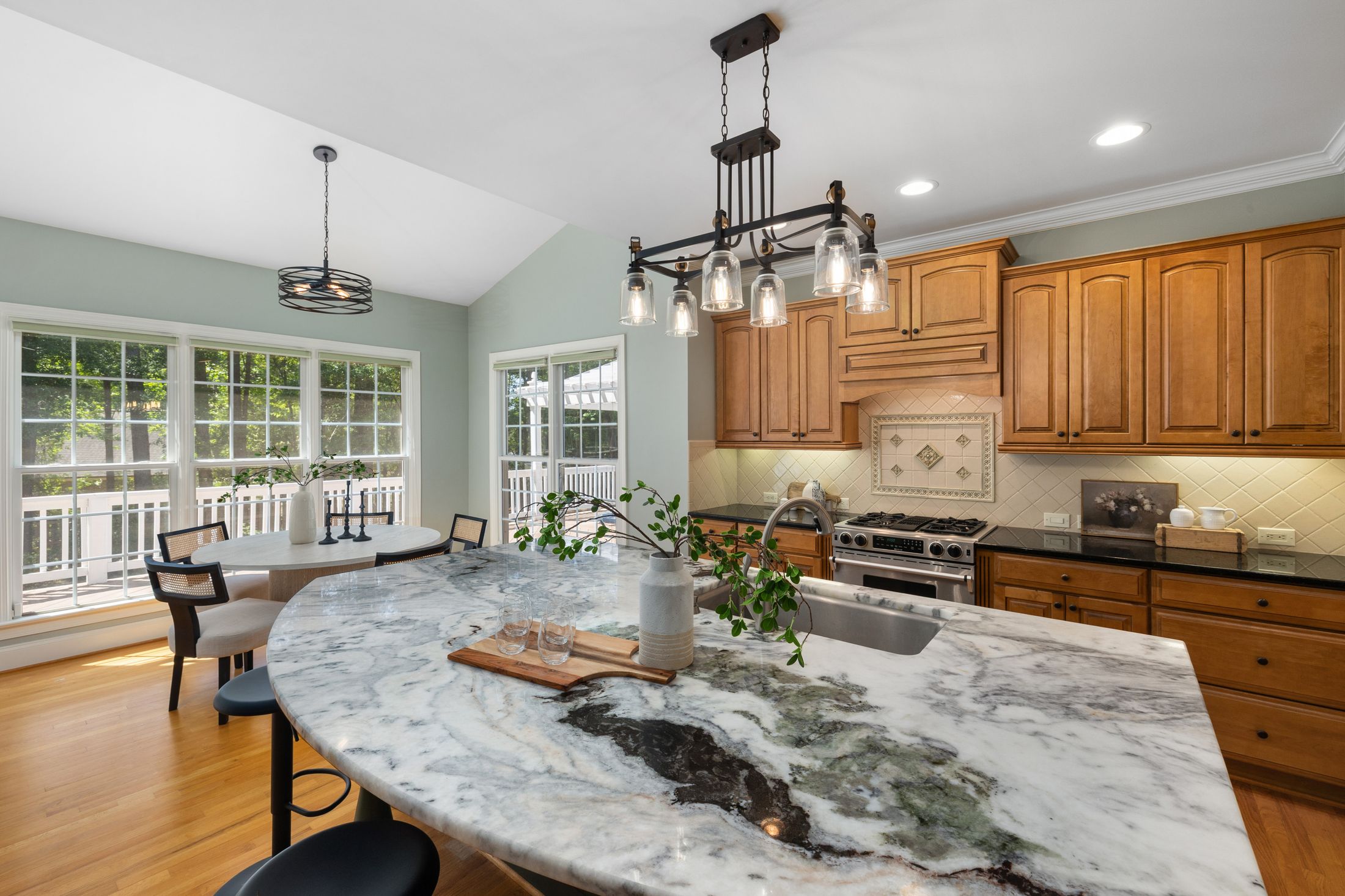 Custom wood kitchen cabinetry with a large island